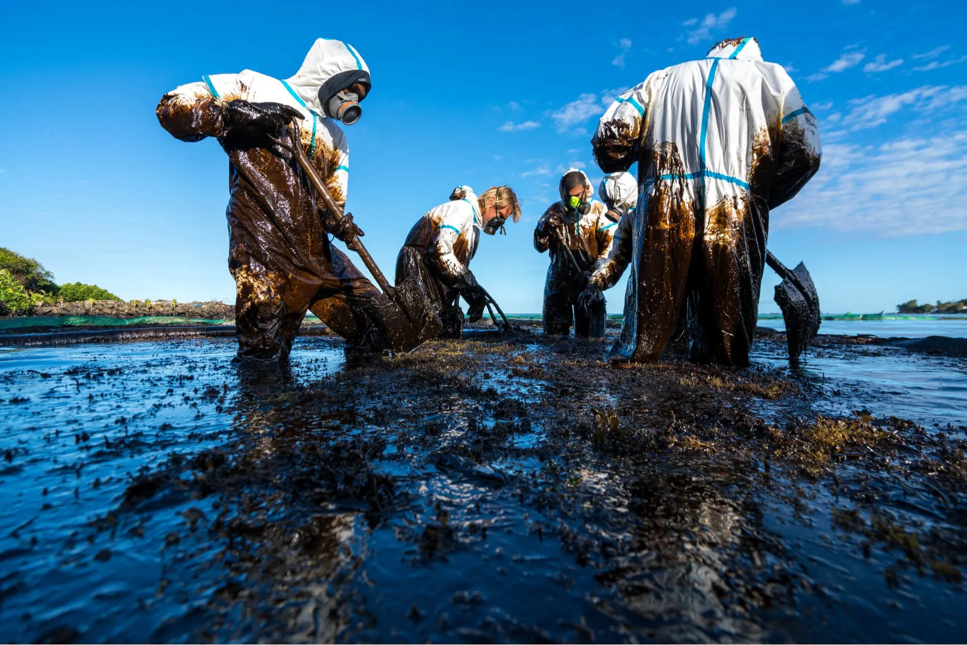 environmental remediation experts cleaning oil spill